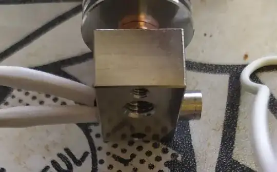 Photo showing heating element protruding from heater block