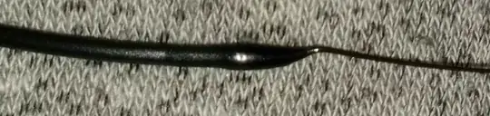 Photo of filament with a blob of filament a the end after being pulled from the hotend Photo of filament with a blob of filament a the end after being pulled from the hotend