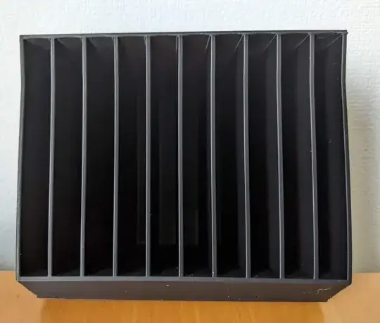 Photo of a 3D printed model of a box with the outer walls bent inwards Photo of a 3D printed model of a box with the outer walls bent inwards