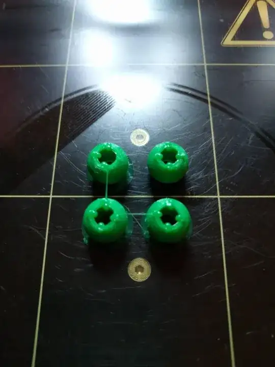 Photo of four balls exhibiting bumps around a cyclindrical through hole