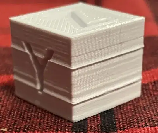 Photo of a calibration cube with strange thick looking layers around the whole print Photo of a calibration cube with strange thick looking layers around the whole print
