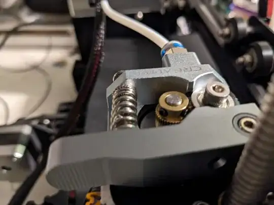 Photo of the Creality metal extruder with the brass hobbed gear too low to reach the filament Photo of the Creality metal extruder with the brass hobbed gear too low to reach the filament