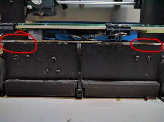 The front of the printer, from where you can see the heated bed support leaning down on the right, even touching the Y-axis chassis.